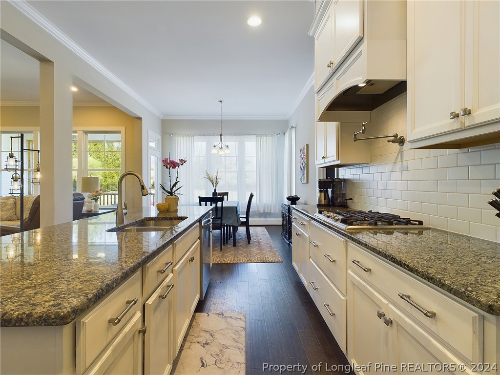 4001 Banks Stone Drive Raleigh, NC 27603 - Photo 15 of 50 a large kitchen with stainless steel appliances granite countertop a lot of counter space