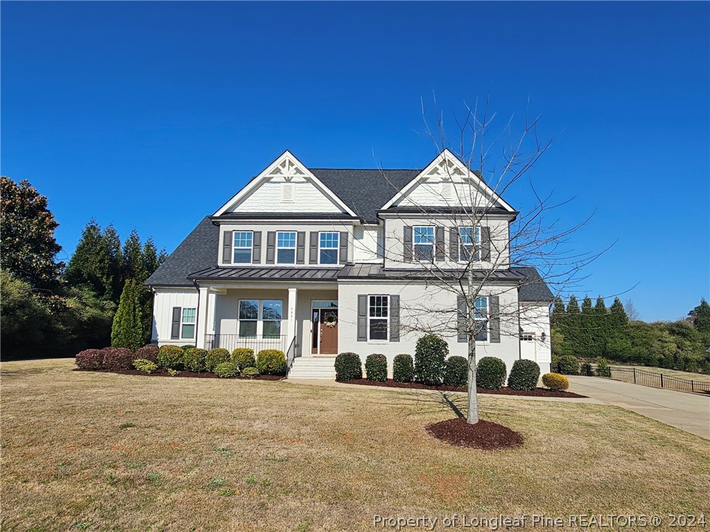 4001 Banks Stone Drive Raleigh, NC 27603 - Photo 2 of 50 a front view of a house with a garden