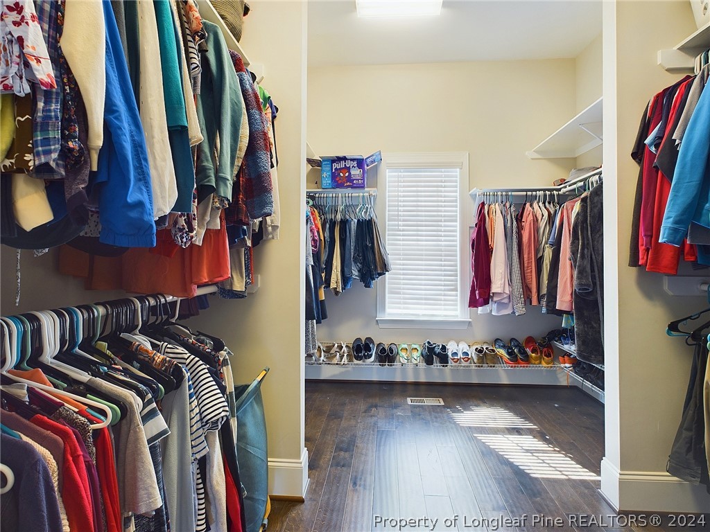 4001 Banks Stone Drive Raleigh, NC 27603 - Photo 23 of 50 a view of walk in closet with clothes and shoes
