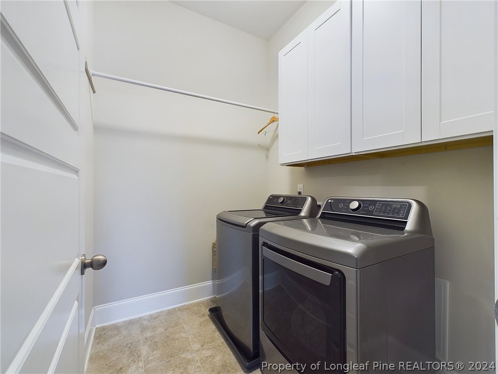 4001 Banks Stone Drive Raleigh, NC 27603 - Photo 25 of 50 a utility room with dryer and washer