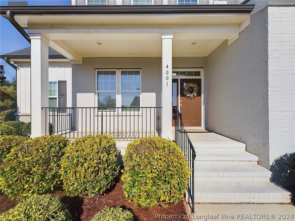 4001 Banks Stone Drive Raleigh, NC 27603 - Photo 3 of 50 a front view of a house with a porch