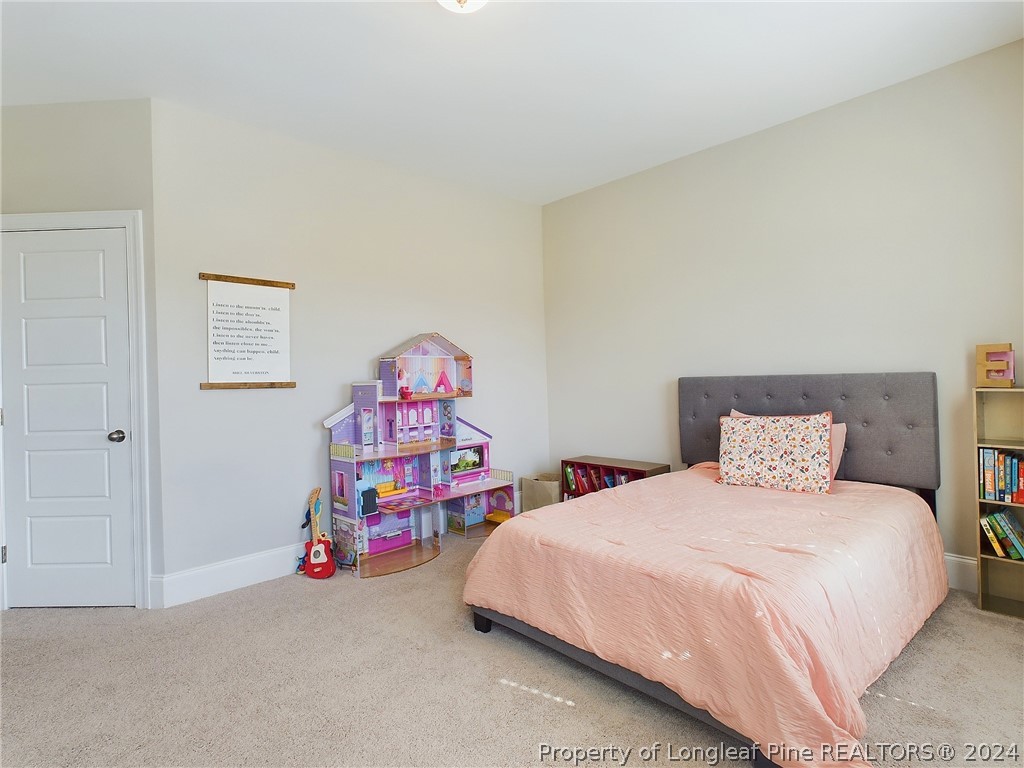 4001 Banks Stone Drive Raleigh, NC 27603 - Photo 31 of 50 a bedroom with a bed and a furniture