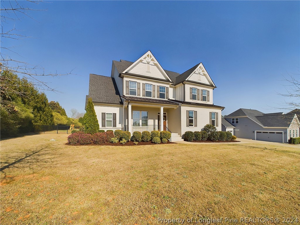 4001 Banks Stone Drive Raleigh, NC 27603 - Photo 41 of 50 a front view of a house with a yard