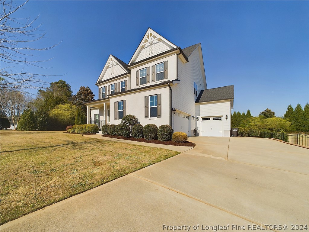 4001 Banks Stone Drive Raleigh, NC 27603 - Photo 44 of 50 a view of a house with a yard