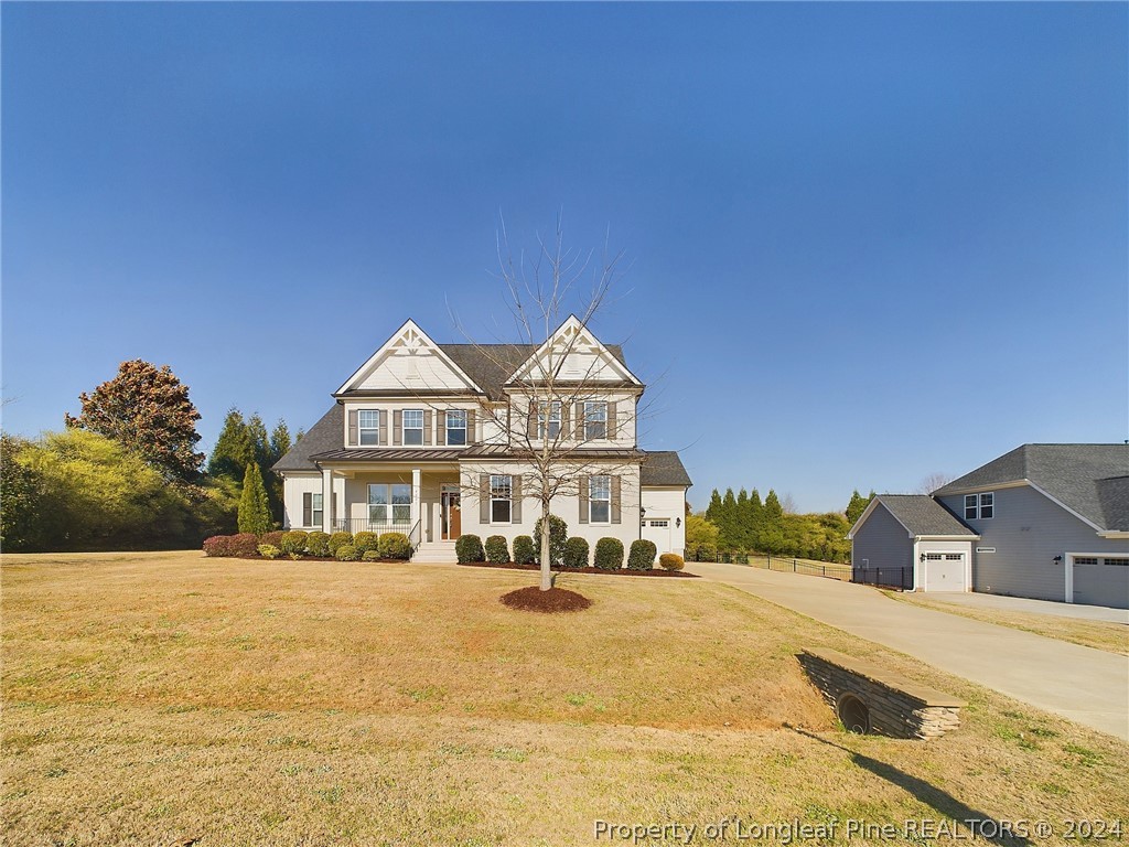 4001 Banks Stone Drive Raleigh, NC 27603 - Photo 46 of 50 a front view of a house with a ocean view