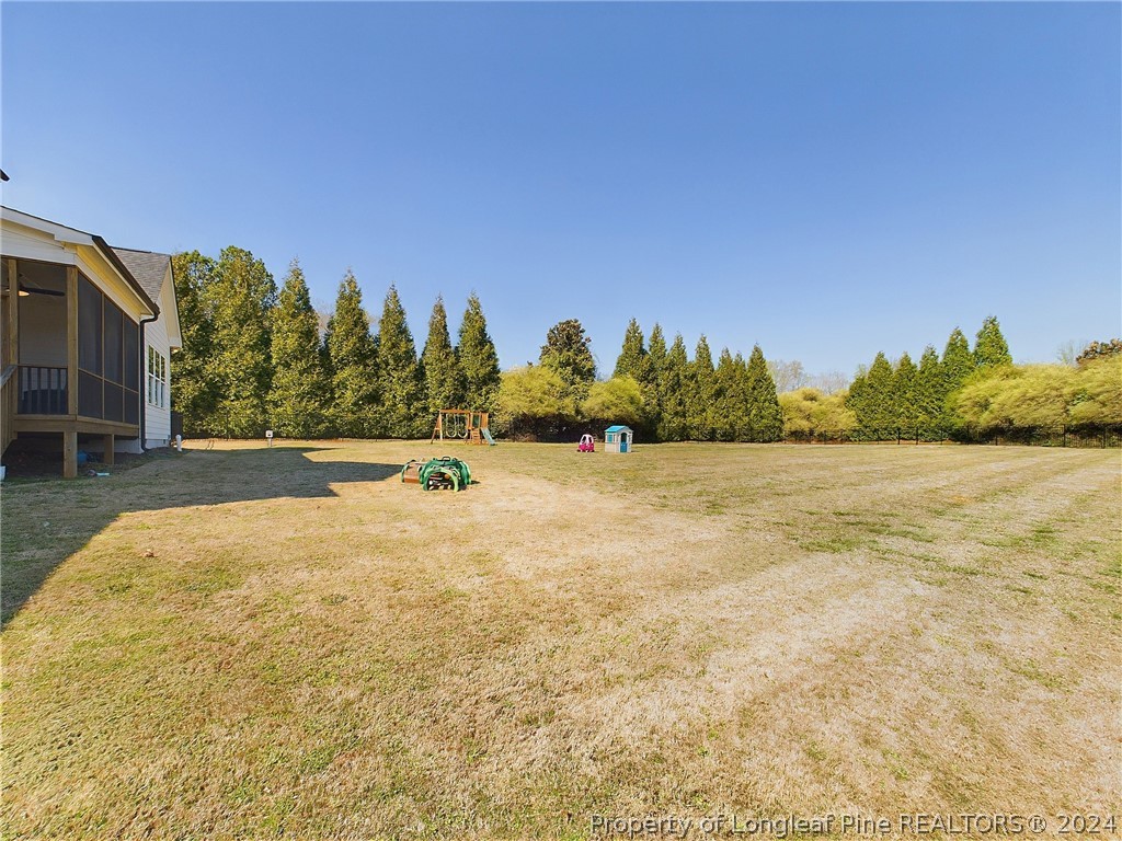 4001 Banks Stone Drive Raleigh, NC 27603 - Photo 49 of 50 a view of swimming pool with an outdoor space and seating area