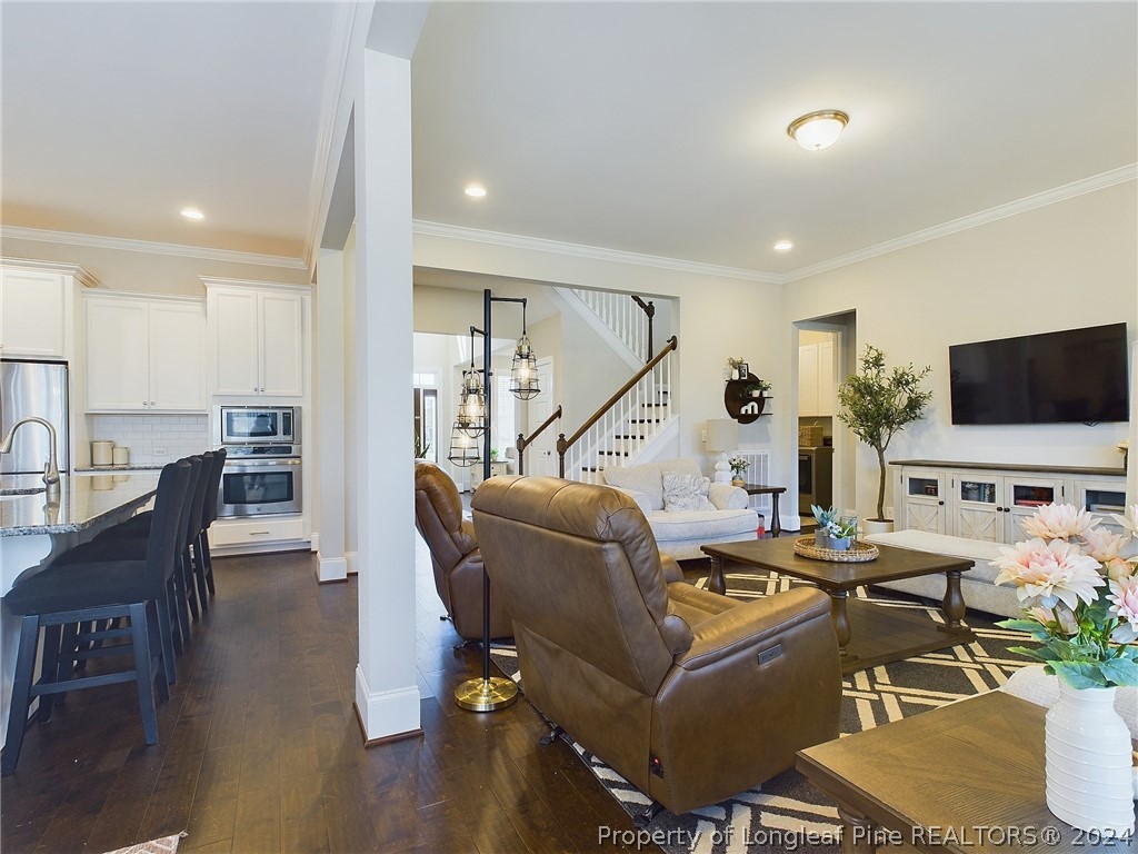 4001 Banks Stone Drive Raleigh, NC 27603 - Photo 8 of 50 a living room with furniture and a flat screen tv