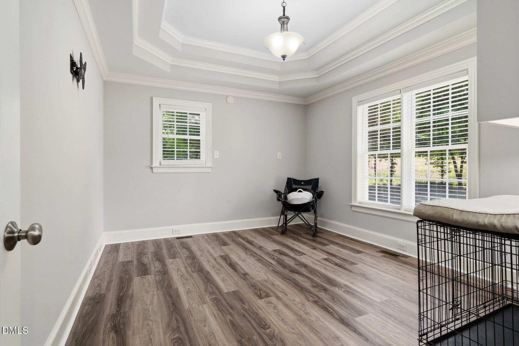 726 Thomas Road Rocky Mount, NC 27801 - Photo 23 of 55 a view of an empty room with a window and wooden floor