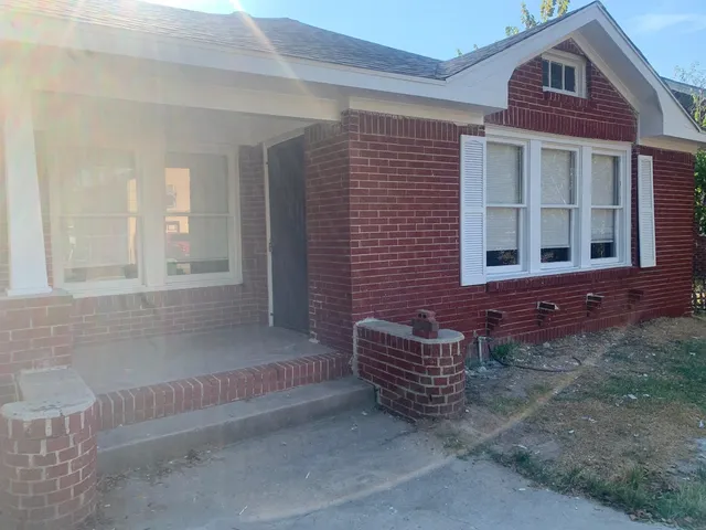 a view of front door of house with a street