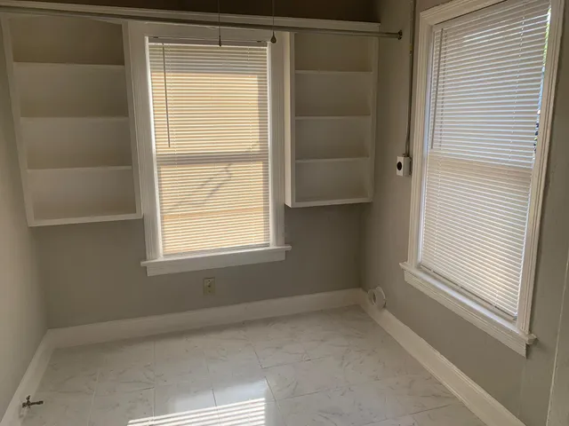 a view of a room that has a window in it