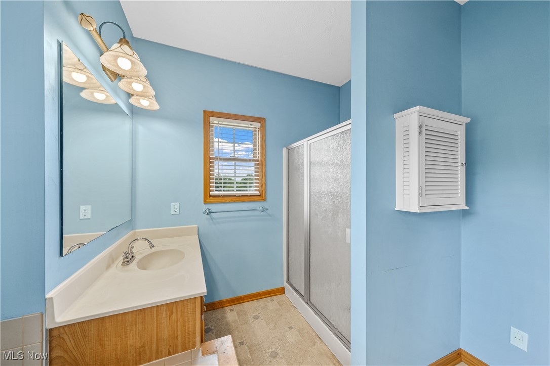 4840 Wayne Road Mantua, OH 44255 - Photo 26 of 42 Primary Suite Glamour Bath with Dual Vanities and soaking tub, walk-in shower, separate water closet room, and linen closet