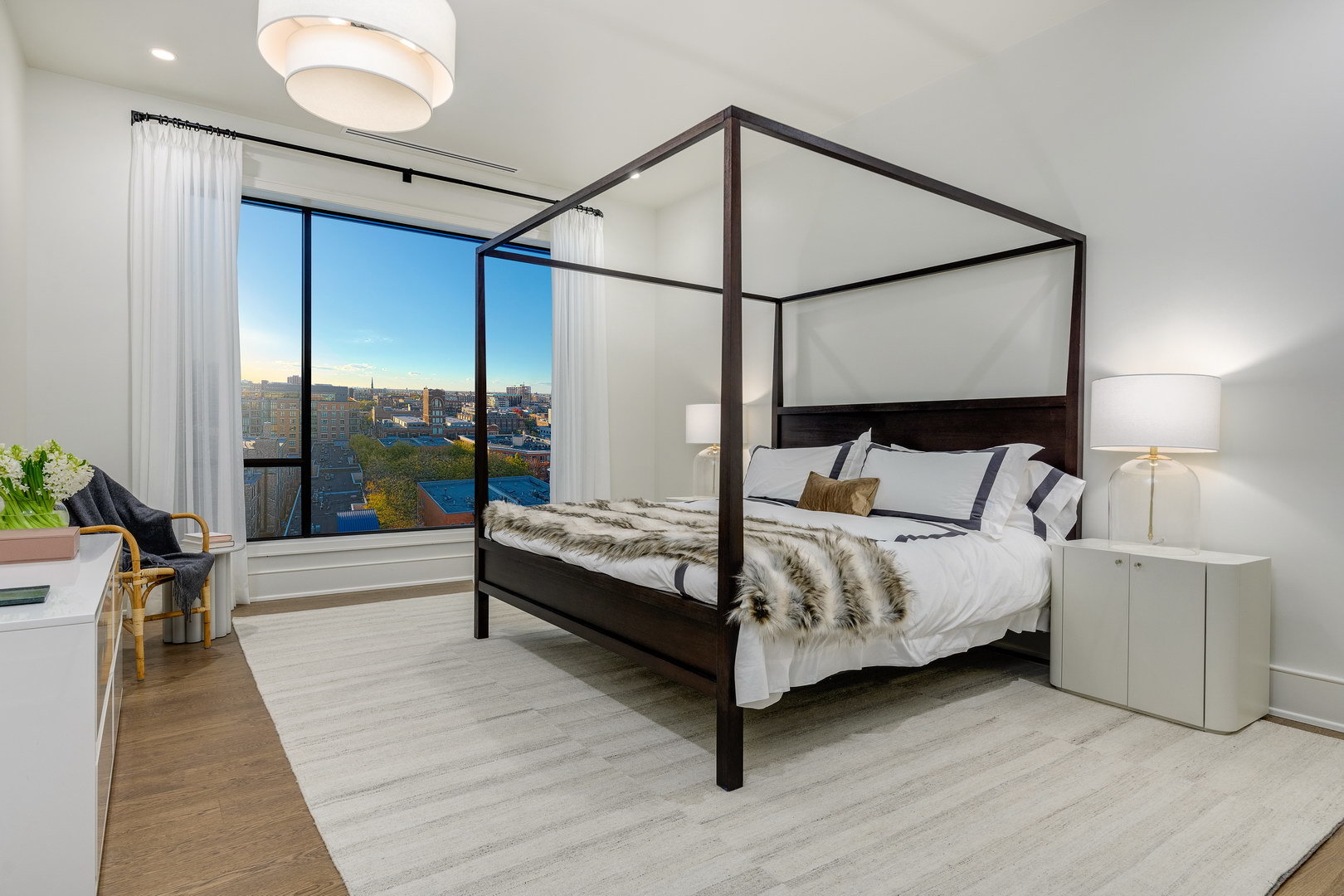 21 North May Street, Unit 405 Chicago, IL 60607 - Photo 18 of 25 a bedroom with a bed and a table in it