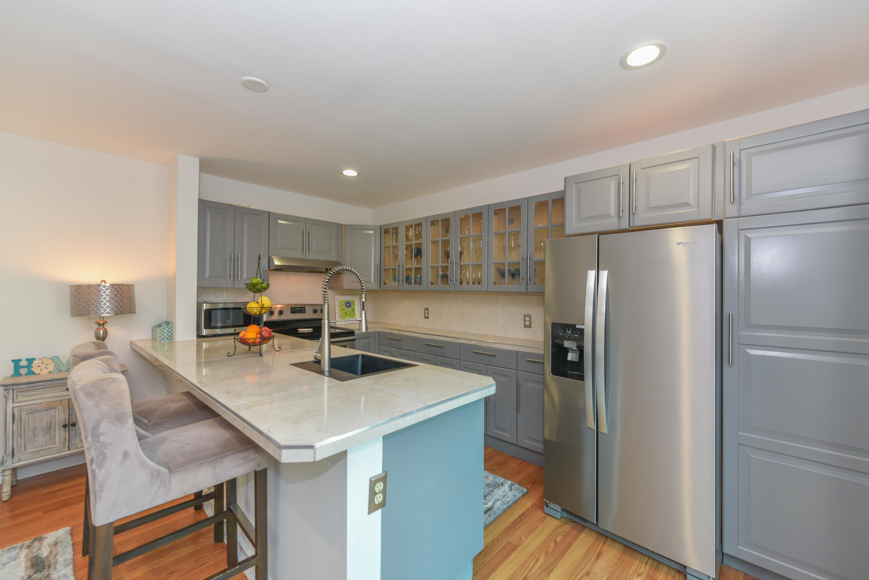 1605 Highway 1, Unit 1D Jupiter, FL 33477 - Photo 17 of 54 a kitchen with stainless steel appliances a refrigerator a table chairs and a refrigerator