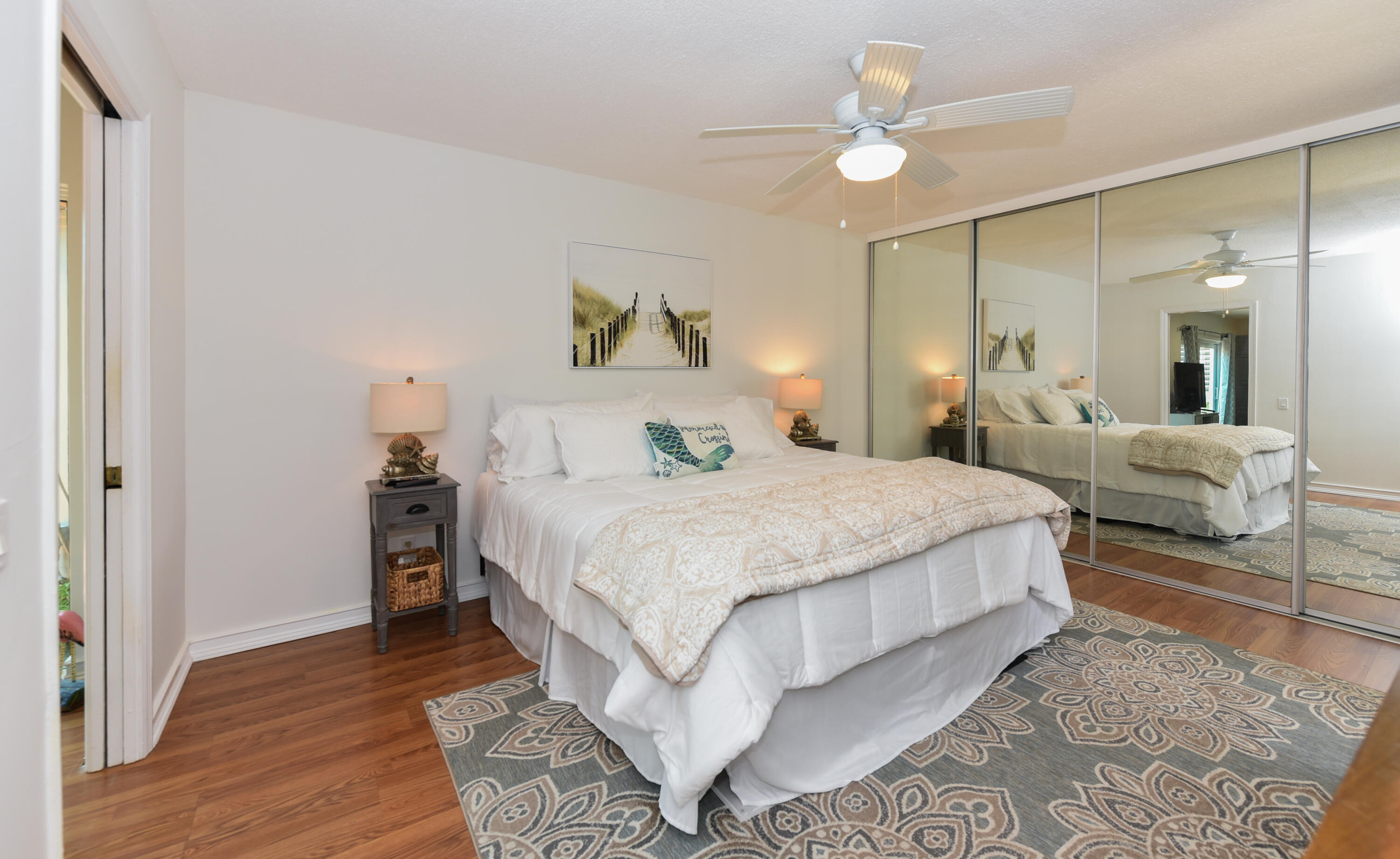 1605 Highway 1, Unit 1D Jupiter, FL 33477 - Photo 20 of 54 a bedroom with a bed and a chandelier