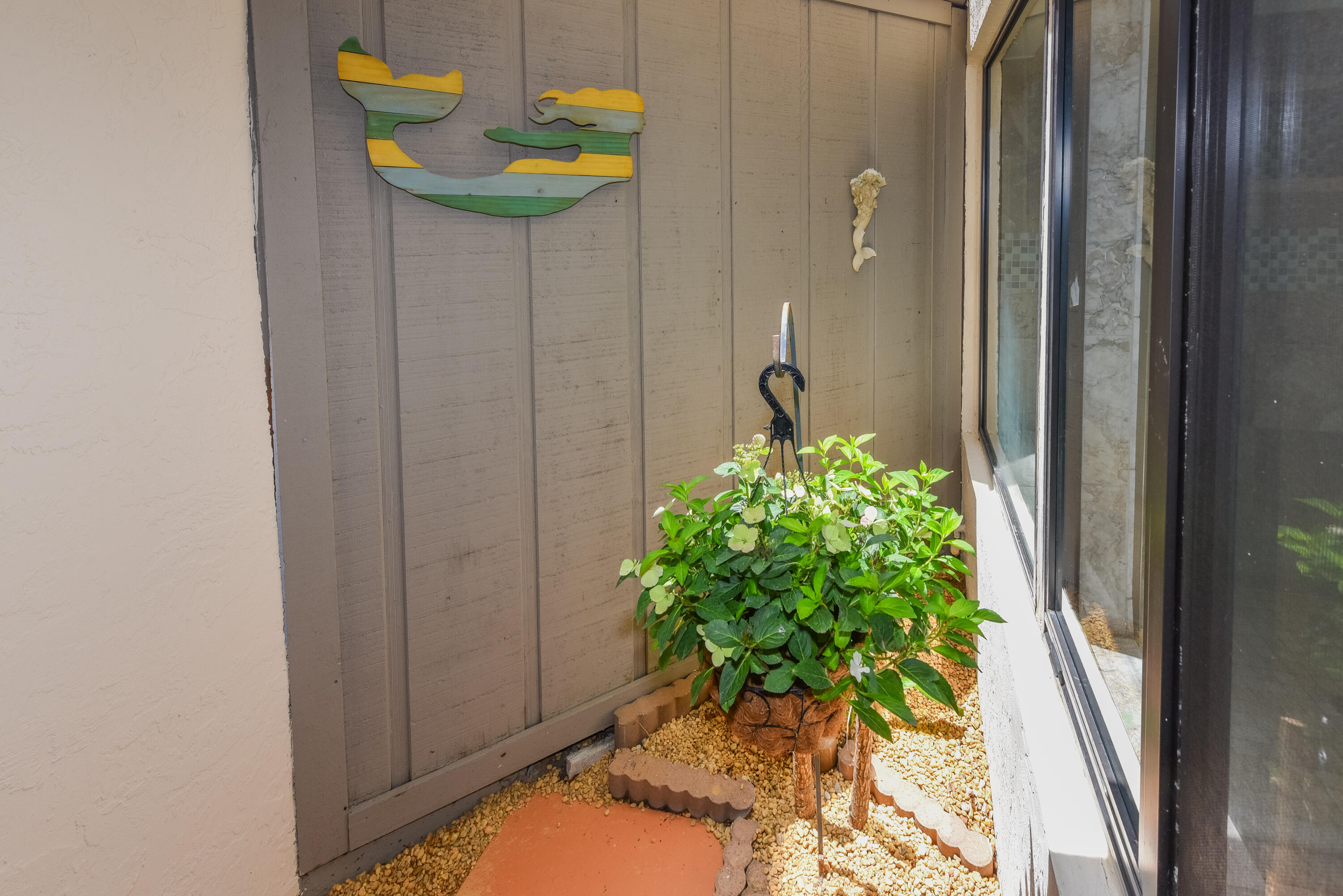 1605 Highway 1, Unit 1D Jupiter, FL 33477 - Photo 22 of 54 a flower pot with a potted plant