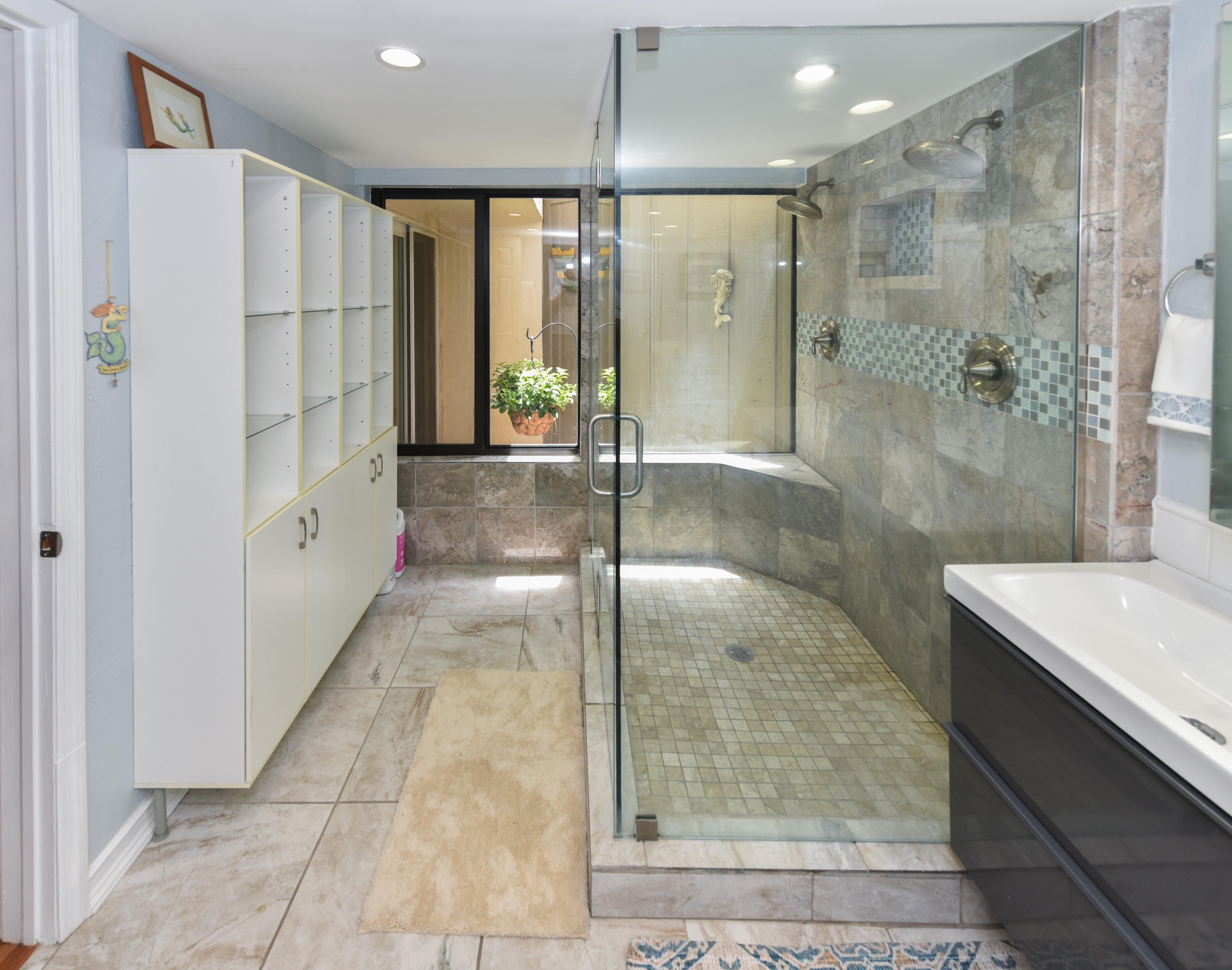 1605 Highway 1, Unit 1D Jupiter, FL 33477 - Photo 25 of 54 a bathroom with a shower