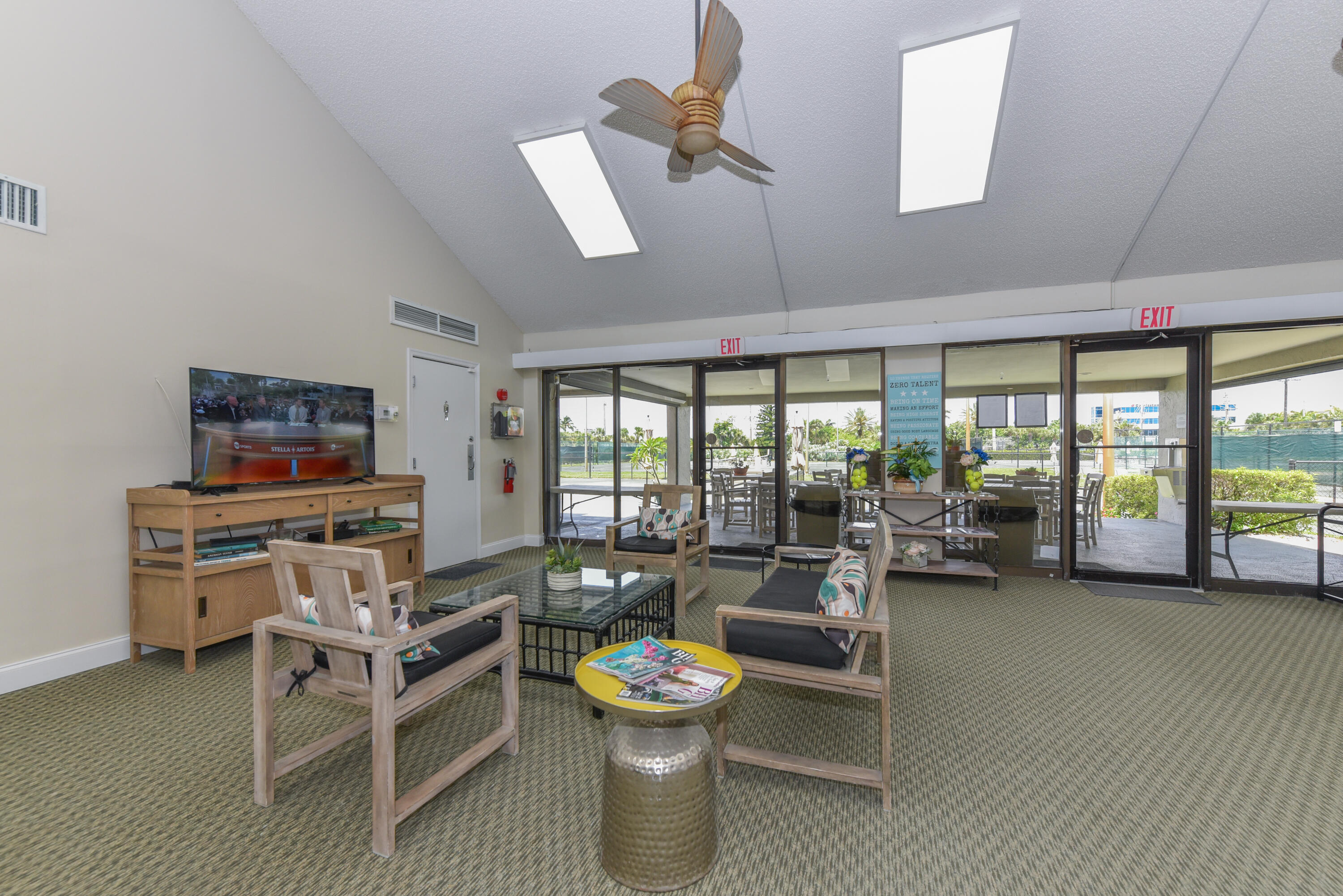 1605 Highway 1, Unit 1D Jupiter, FL 33477 - Photo 32 of 54 a living room with furniture and a flat screen tv