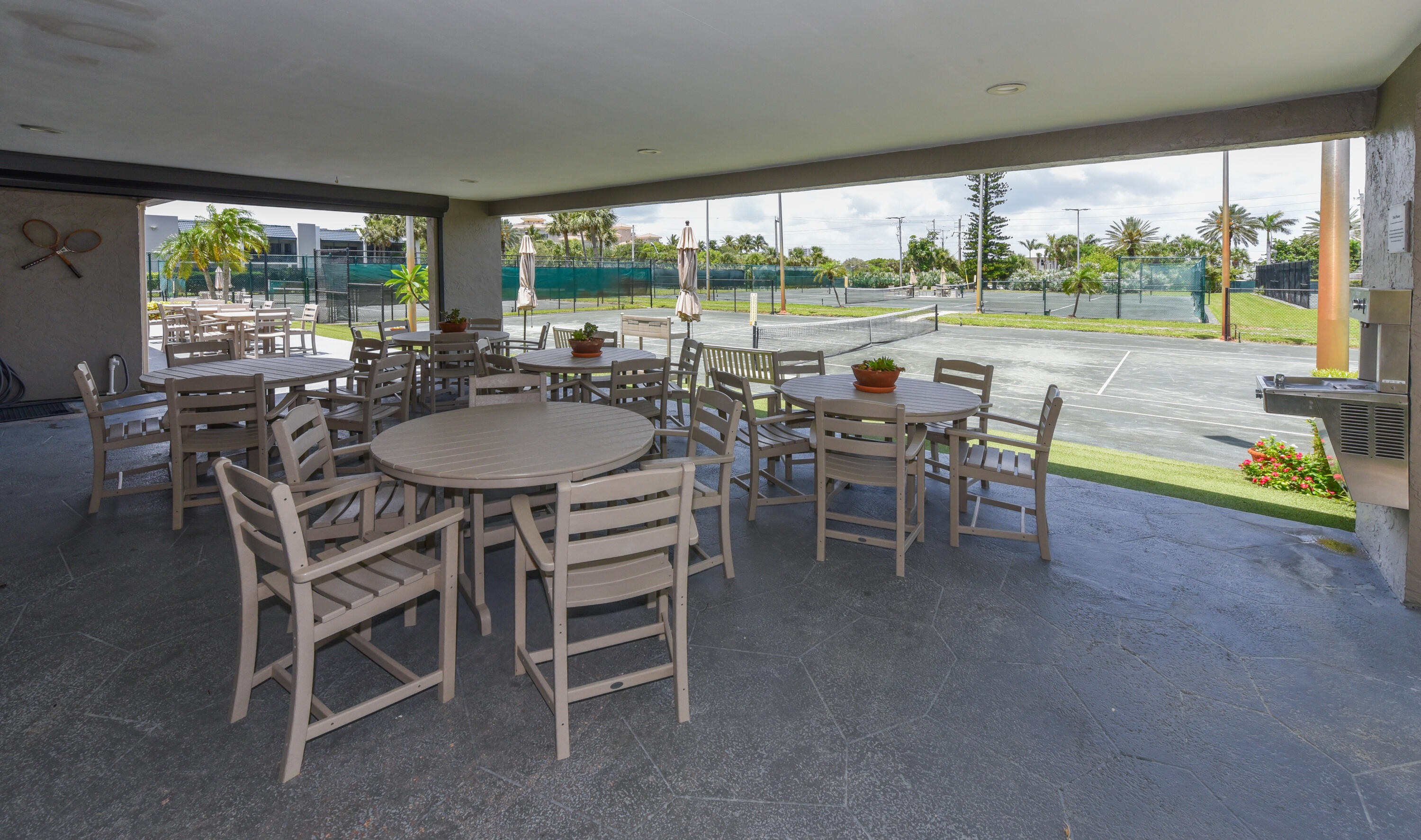 1605 Highway 1, Unit 1D Jupiter, FL 33477 - Photo 36 of 54 a dining room with furniture and a floor to ceiling window