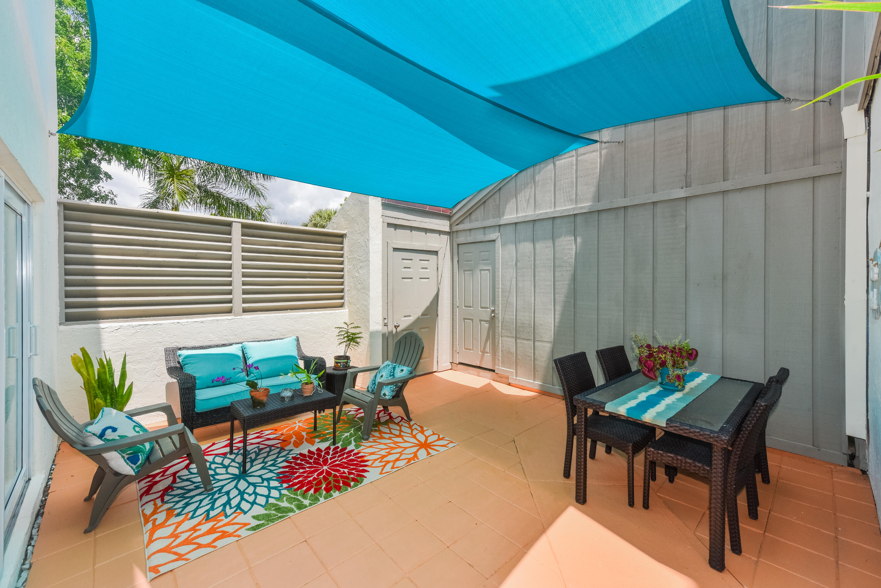 1605 Highway 1, Unit 1D Jupiter, FL 33477 - Photo 4 of 54 a backyard of a house with seating space