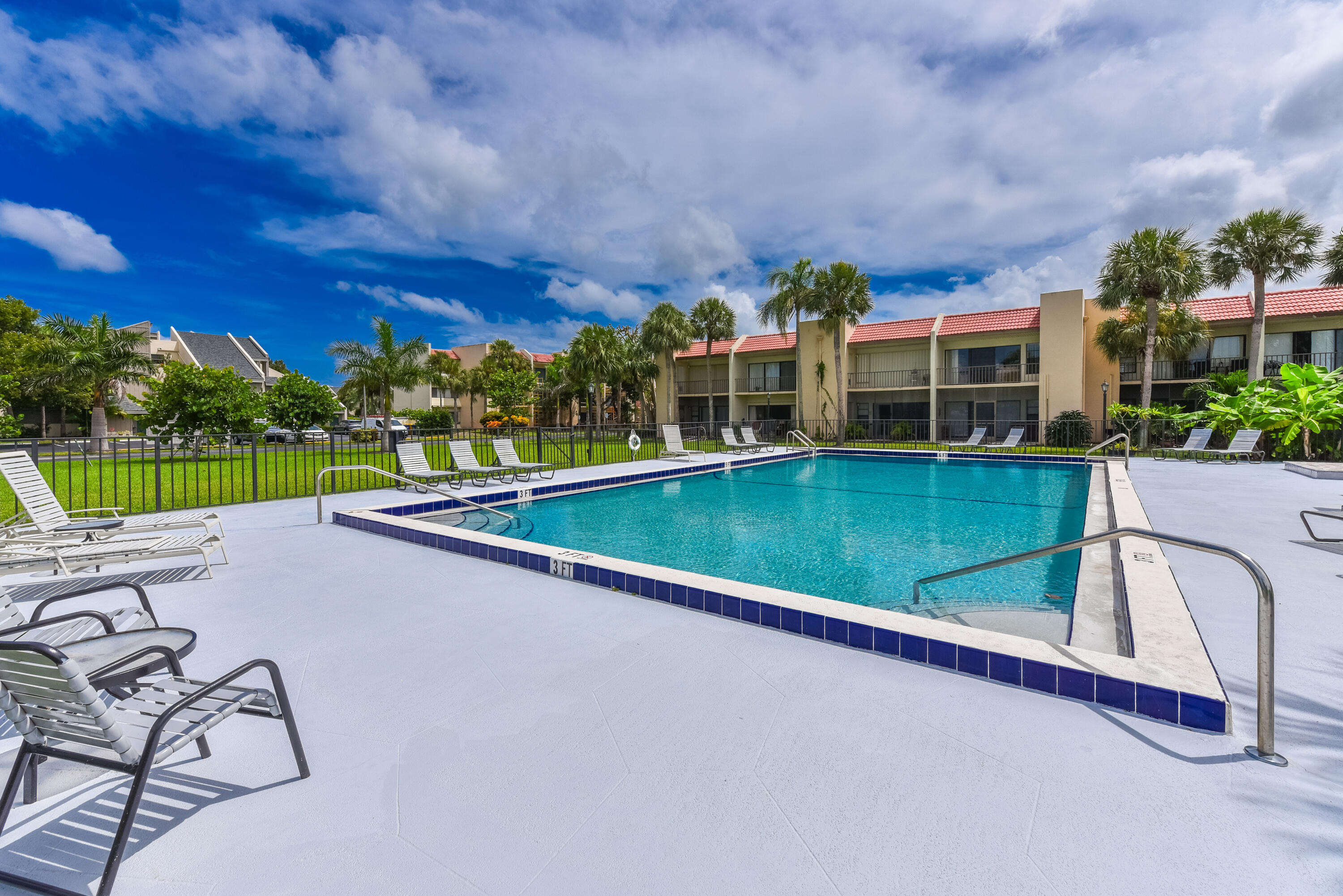 1605 Highway 1, Unit 1D Jupiter, FL 33477 - Photo 42 of 54 swimming pool view with a seating space and a garden view