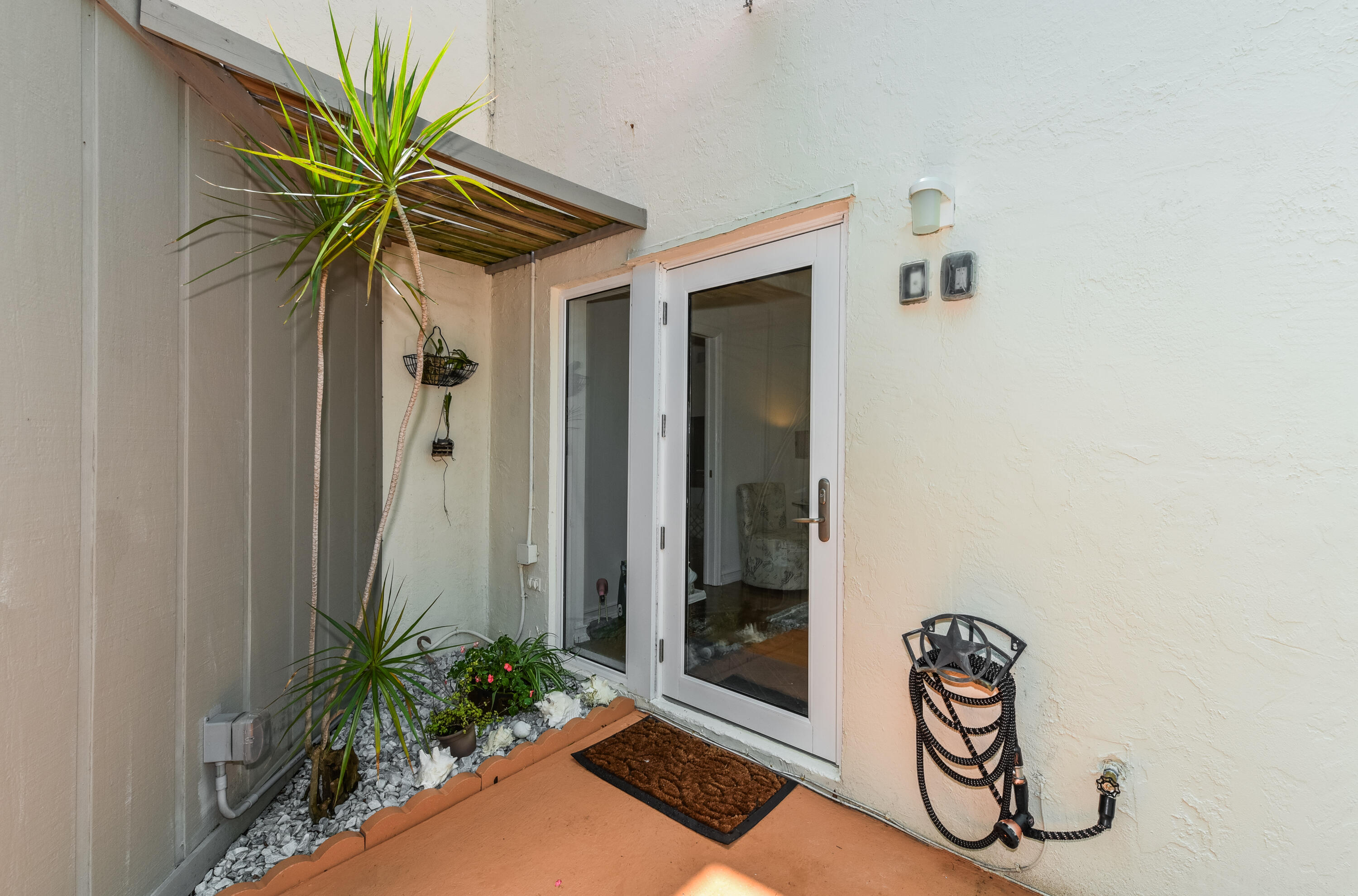 1605 Highway 1, Unit 1D Jupiter, FL 33477 - Photo 7 of 54 a view of entryway with a potted plant