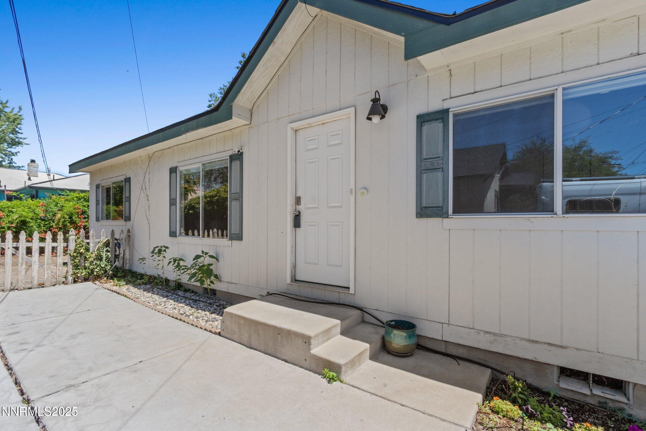 534 Cheney Street Reno, NV 89502 - Photo 1 of 28 a front view of a house with potted plants