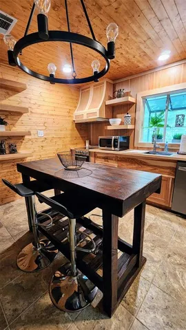 a bathroom with a granite countertop toilet a sink and a mirror