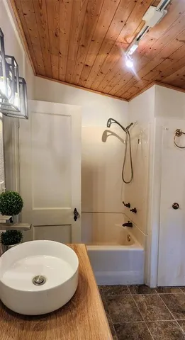 a view of backyard with wooden deck and floor