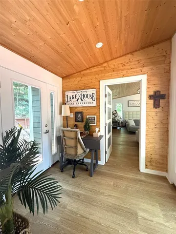a view of a livingroom with furniture and windows