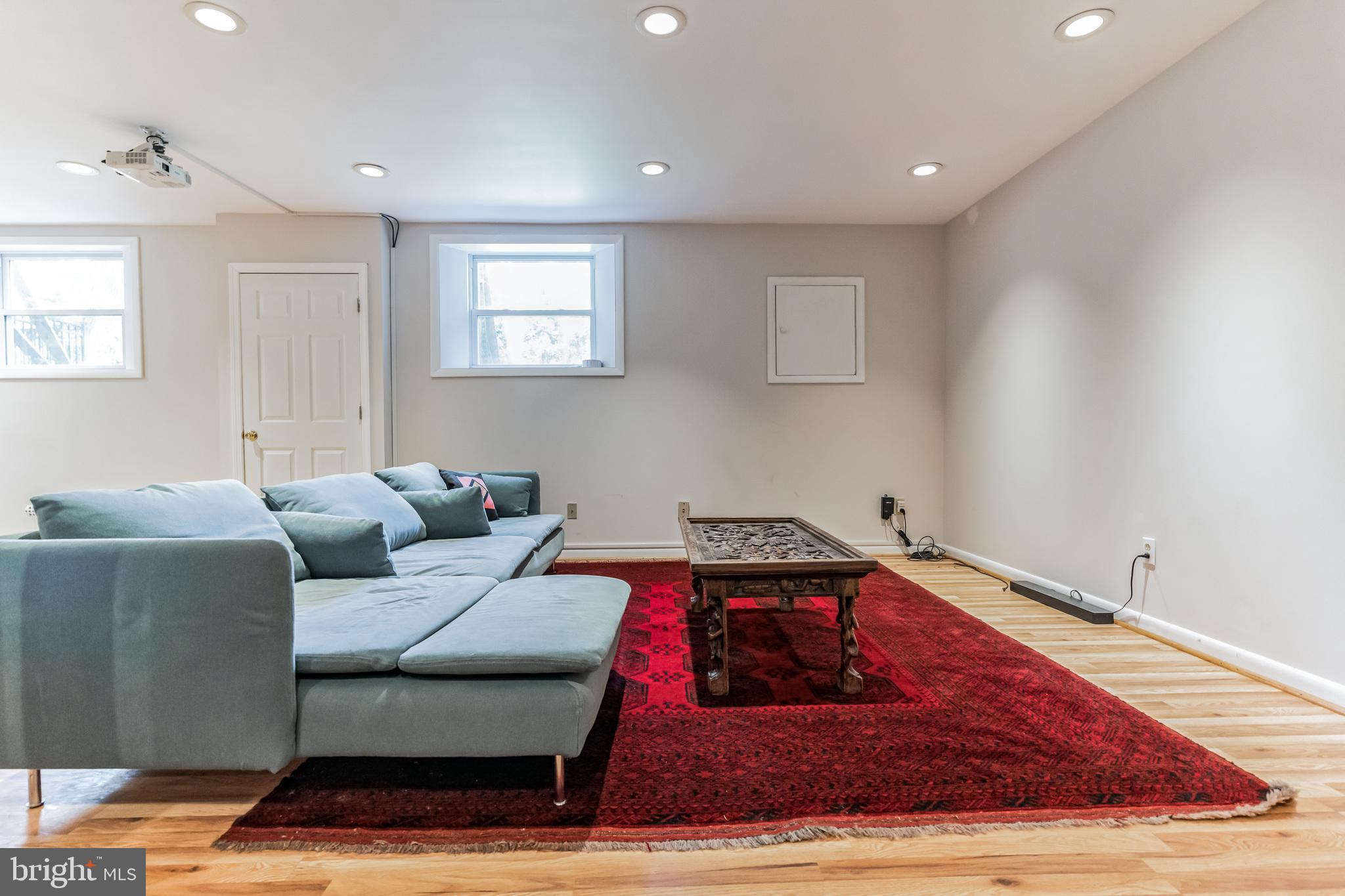 9329 Harvey Road Silver Spring, MD 20910 - Photo 24 of 40 a living room with furniture and a rug