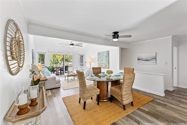 a view of a dining room with furniture window and wooden floor