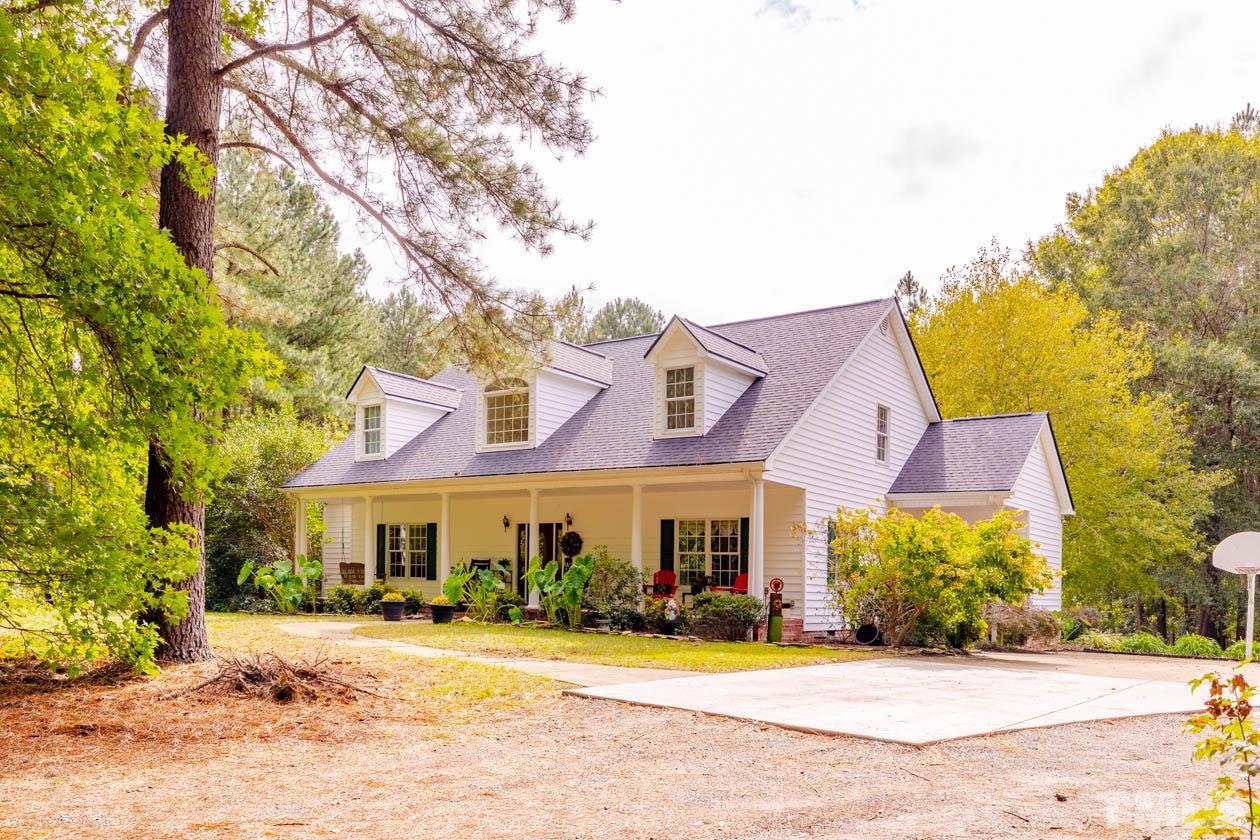3197 A Walters Road Creedmoor, NC 27522 - Photo 1 of 50 a front view of a building with garden and trees