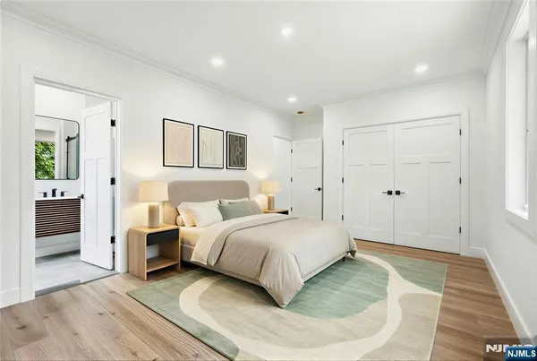 a bedroom with a bed and a walk in closet