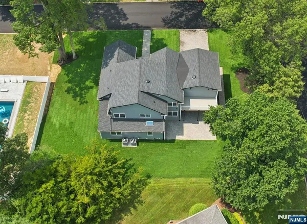an aerial view of a house with a garden