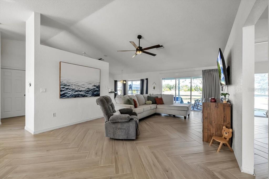 320 Tandil Street Punta Gorda, FL 33983 - Photo 11 of 67 a living room with furniture and a large window