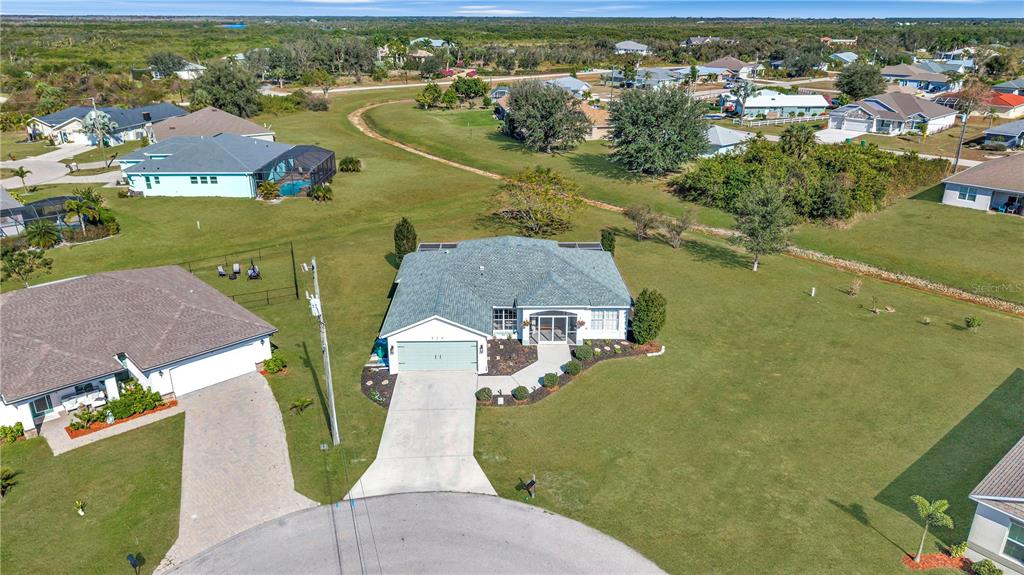 320 Tandil Street Punta Gorda, FL 33983 - Photo 2 of 67 an aerial view of a house with a lake view