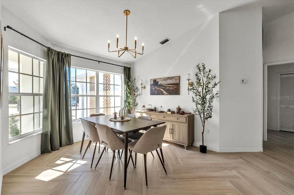 320 Tandil Street Punta Gorda, FL 33983 - Photo 25 of 67 a view of a dining room with furniture window and wooden floor