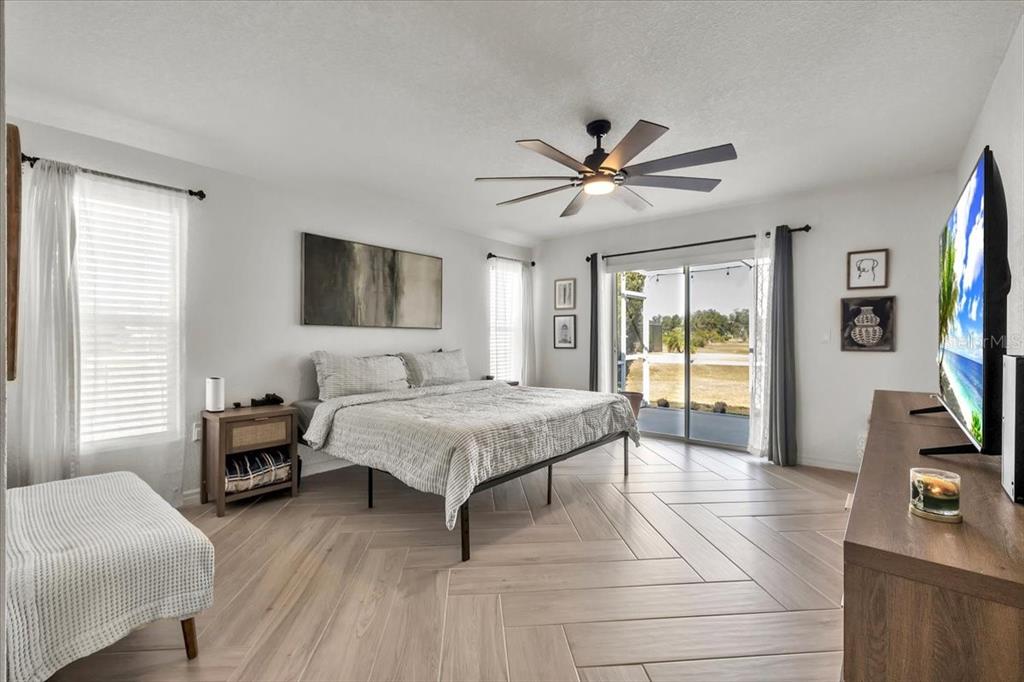 320 Tandil Street Punta Gorda, FL 33983 - Photo 30 of 67 a bedroom with a bed and a flat screen tv