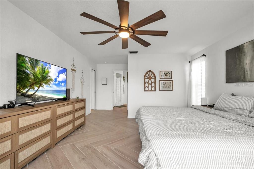 320 Tandil Street Punta Gorda, FL 33983 - Photo 33 of 67 a bedroom with a bed and a flat screen tv