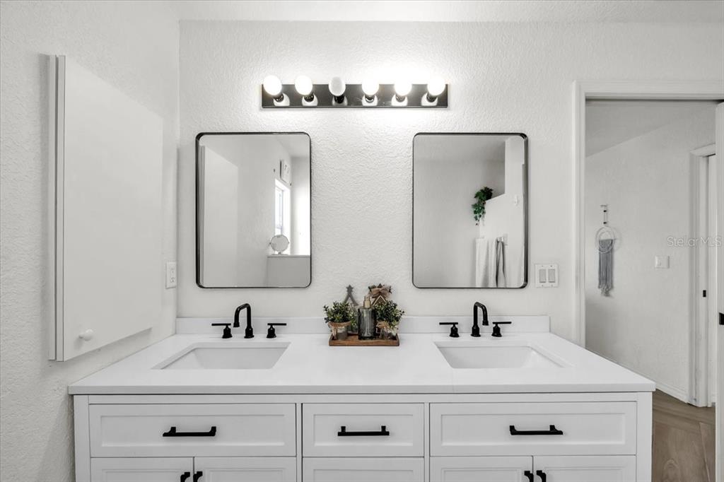 320 Tandil Street Punta Gorda, FL 33983 - Photo 37 of 67 a bathroom with double vanity sinks and a mirror