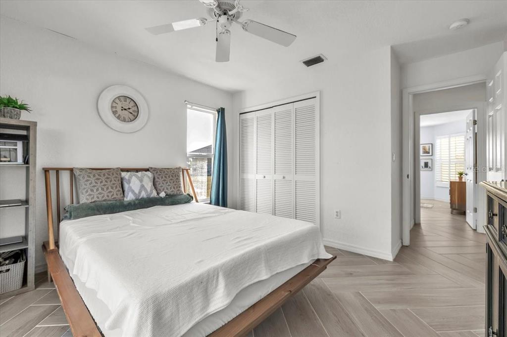 320 Tandil Street Punta Gorda, FL 33983 - Photo 45 of 67 a bedroom with a bed and a chandelier