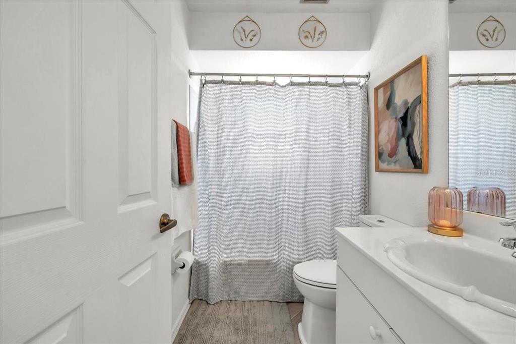 320 Tandil Street Punta Gorda, FL 33983 - Photo 48 of 67 a bathroom with a sink a toilet and shower curtain