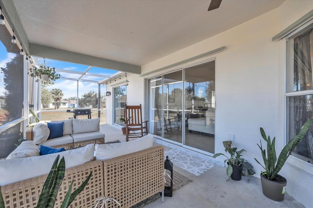 320 Tandil Street Punta Gorda, FL 33983 - Photo 50 of 67 a living room with furniture plant and a large window