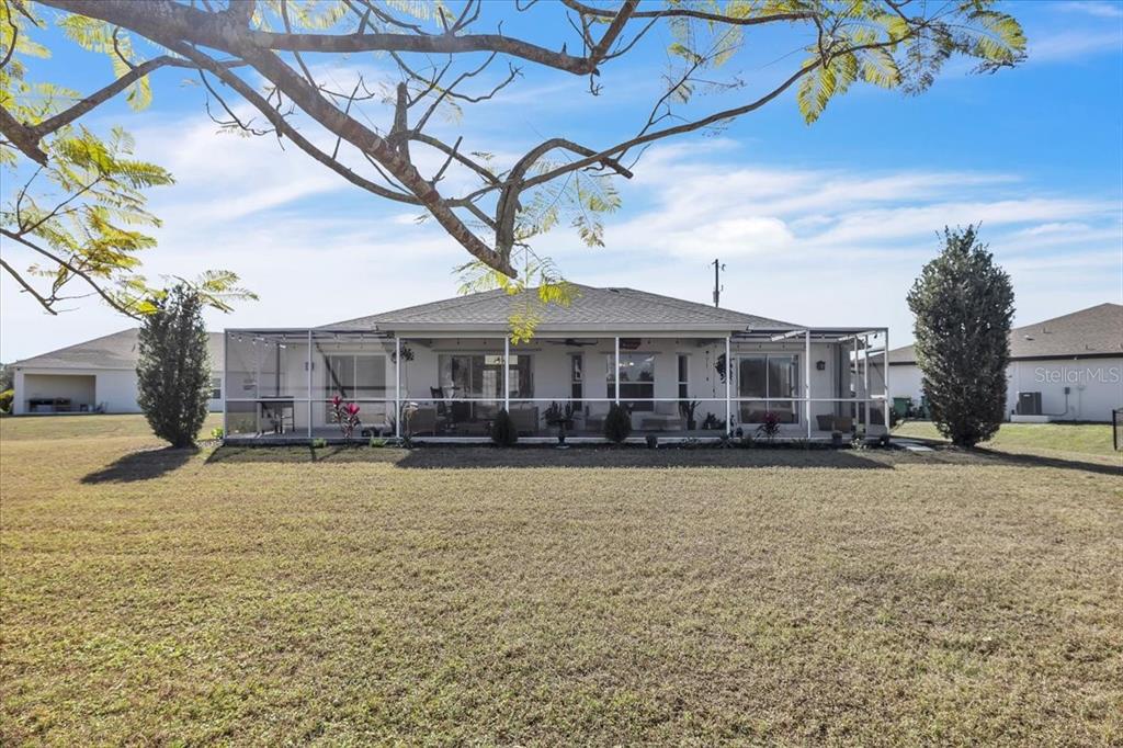 320 Tandil Street Punta Gorda, FL 33983 - Photo 58 of 67 a front view of a house with a yard