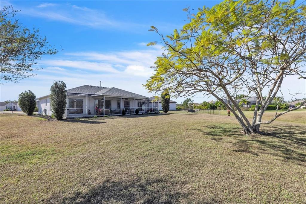 320 Tandil Street Punta Gorda, FL 33983 - Photo 59 of 67 a front view of a house with a yard