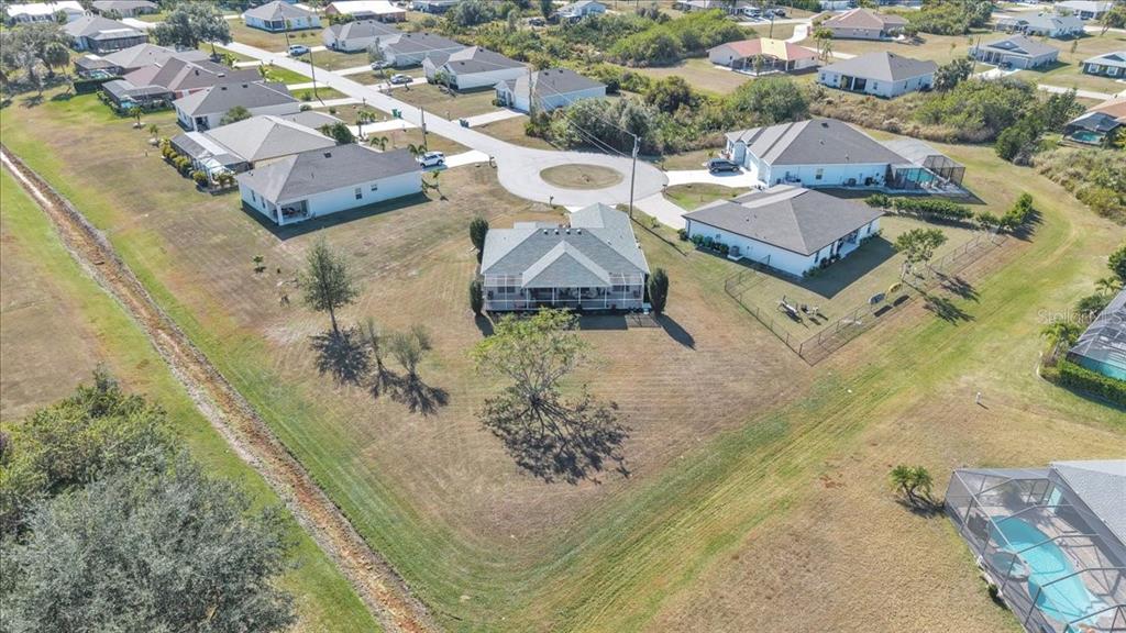 320 Tandil Street Punta Gorda, FL 33983 - Photo 63 of 67 an aerial view of a house with a yard