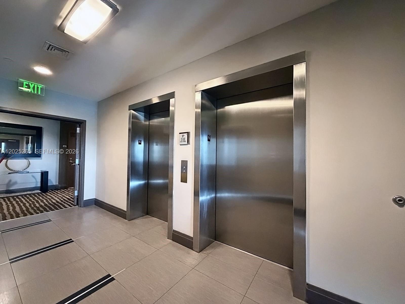2525 Southwest 3rd Avenue, Unit 705 Miami, FL 33129 - Photo 22 of 26 a view of a hallway with a livingroom with furniture