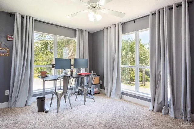 a view of a livingroom with furniture and a window