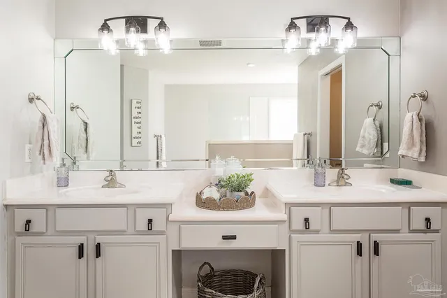 a bathroom with a sink double vanity and a mirror