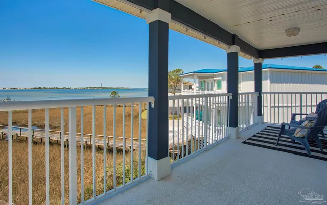 a view of a balcony with chairs